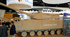   K21   Cockerill XC-8  CMI Defence   120 .  . , IDEX 2013